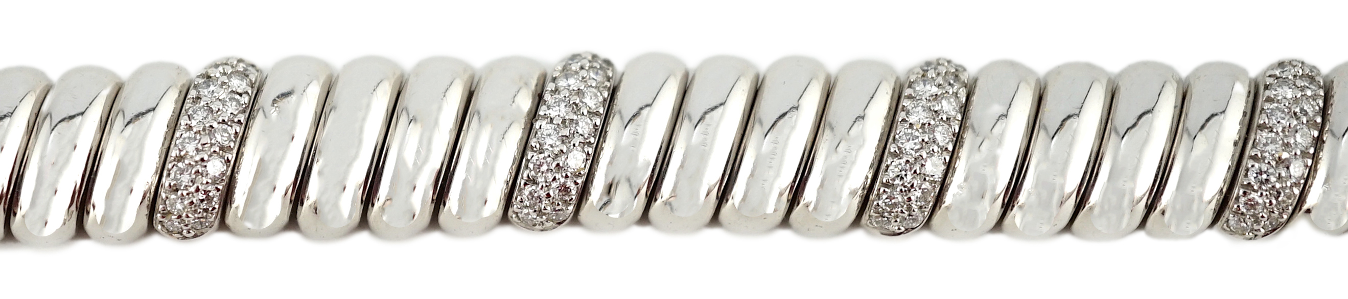 A modern Cartier 18ct white gold and diamond cluster set bracelet